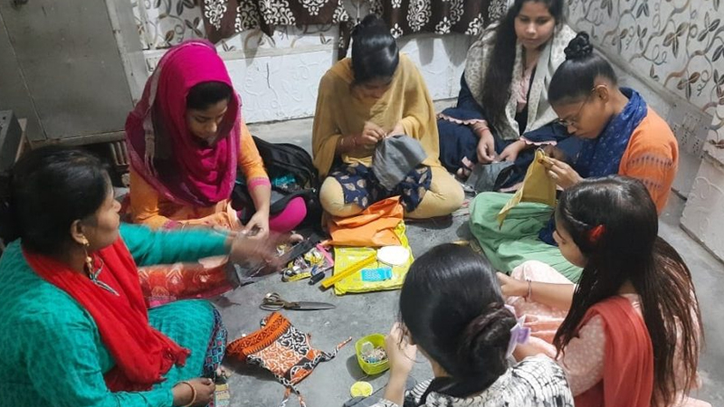 Cutting, stitching and embroidery skill development classes for women at Bhajanpura, Delhi.
